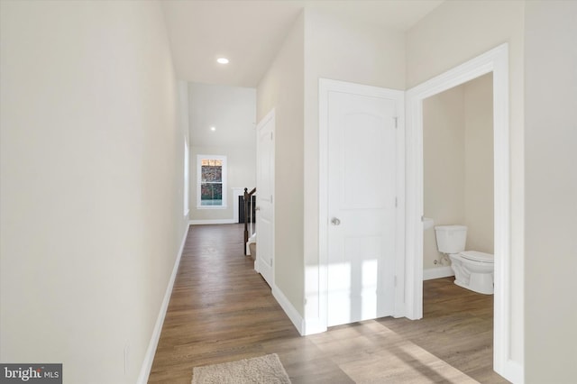 corridor with light wood-type flooring