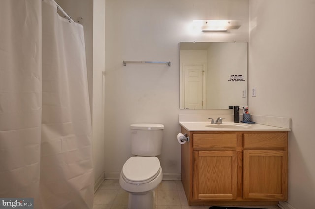 bathroom with tile patterned flooring, vanity, toilet, and a shower with shower curtain