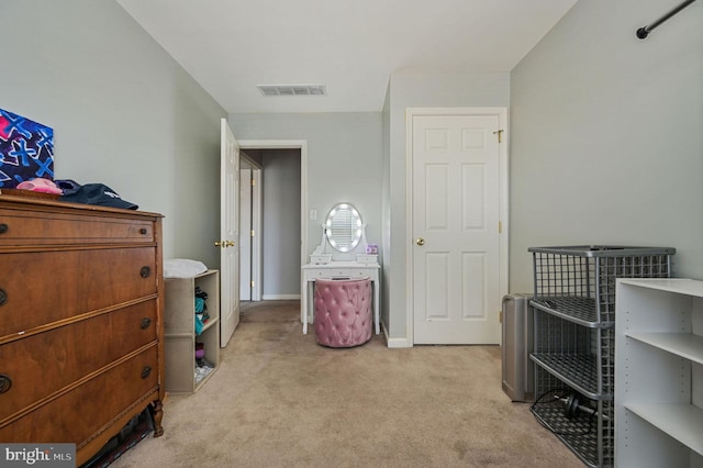 bedroom featuring light carpet