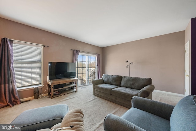 living room featuring light colored carpet