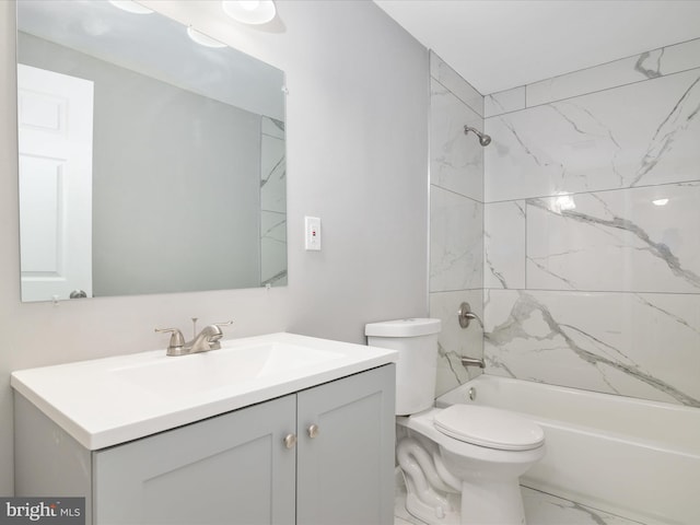 full bathroom featuring vanity, toilet, and tiled shower / bath combo