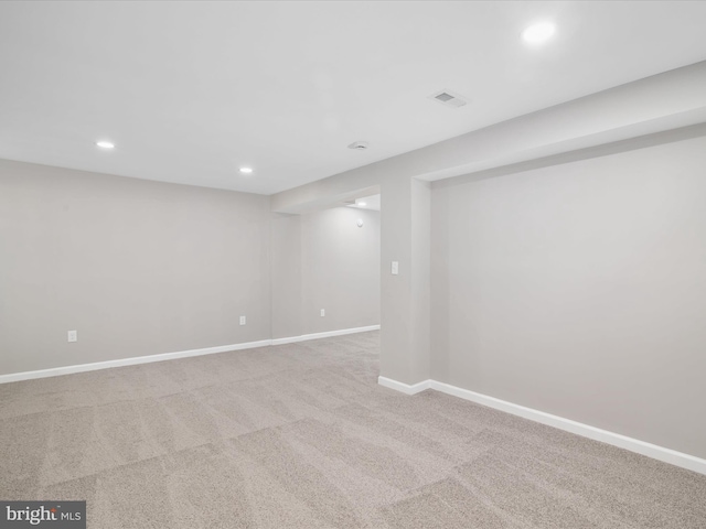 basement with light colored carpet