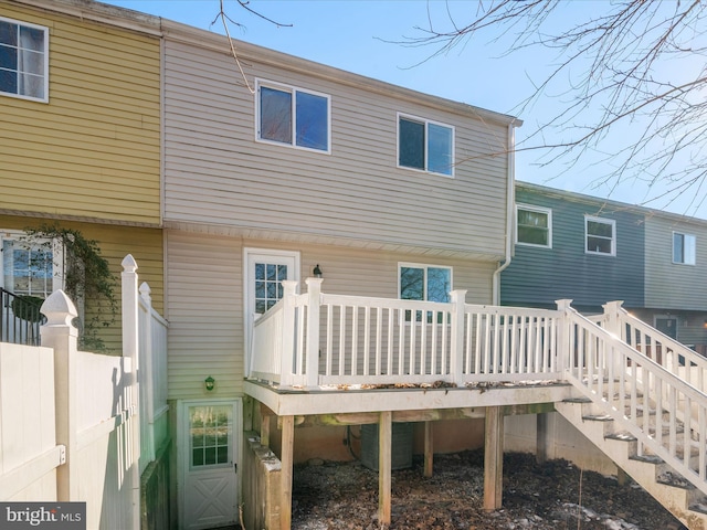 back of house featuring a wooden deck