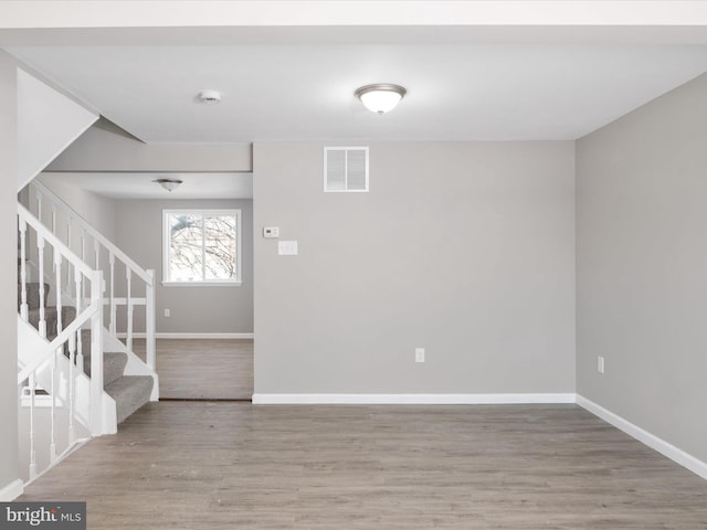 empty room with wood-type flooring