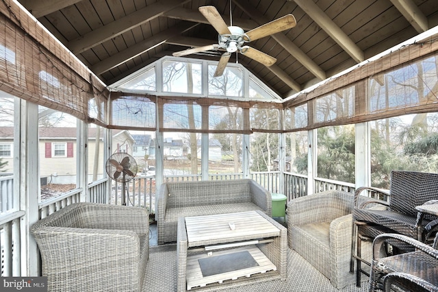 sunroom / solarium with wood ceiling, lofted ceiling with beams, and ceiling fan