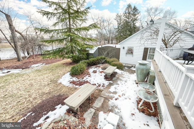 view of yard layered in snow