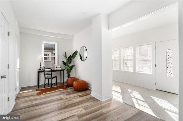 entryway with light hardwood / wood-style floors