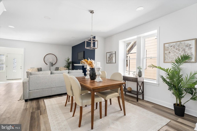 dining area with hardwood / wood-style floors