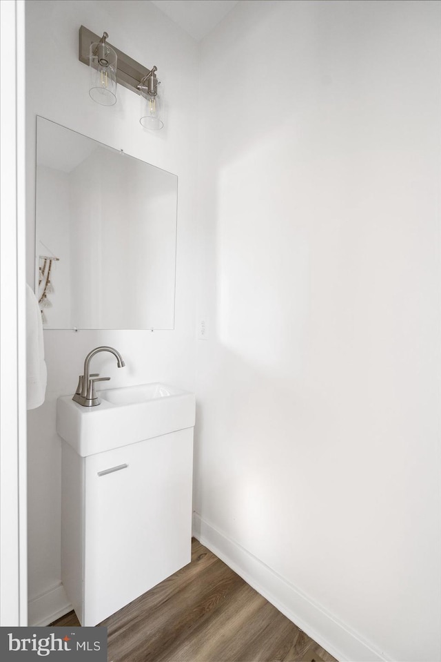 bathroom featuring vanity and hardwood / wood-style flooring