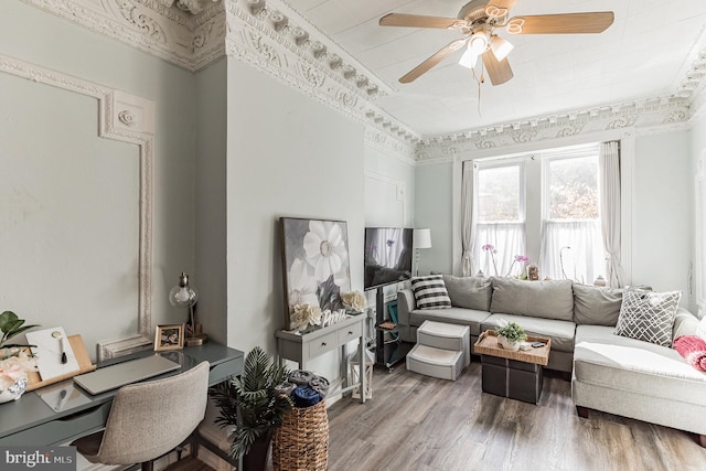 living room with hardwood / wood-style flooring and ceiling fan