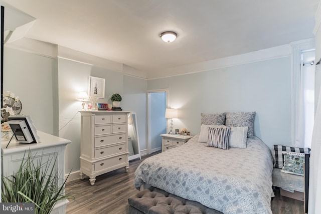 bedroom featuring dark hardwood / wood-style floors