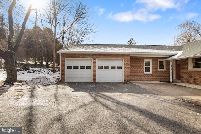 view of snow covered garage