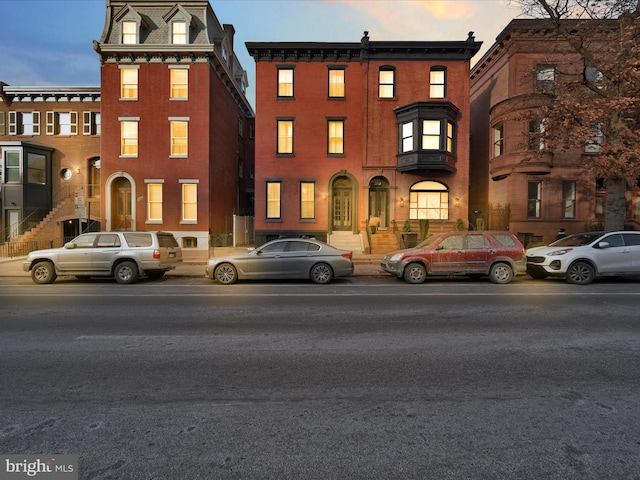 view of outdoor building at dusk