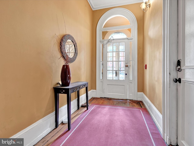 doorway to outside featuring hardwood / wood-style flooring and ornamental molding