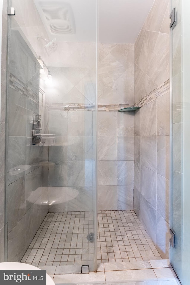 full bath featuring visible vents and a shower stall