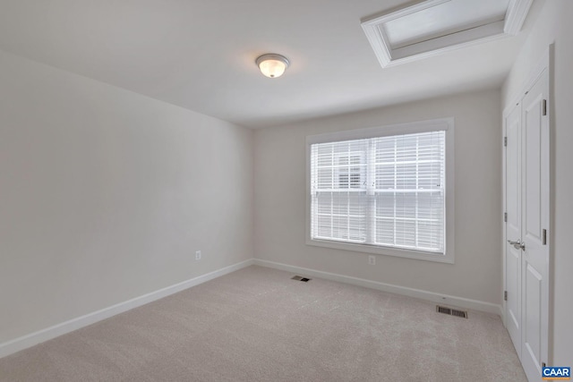 unfurnished room with light carpet