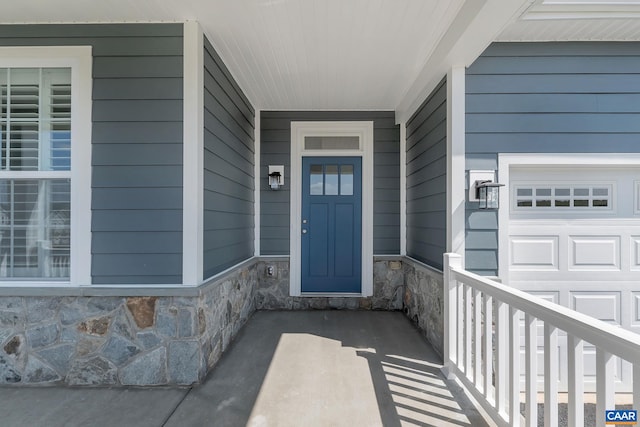 doorway to property with a garage