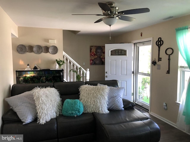 living room featuring ceiling fan and hardwood / wood-style floors