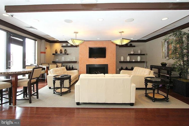 living room featuring a large fireplace and light hardwood / wood-style floors