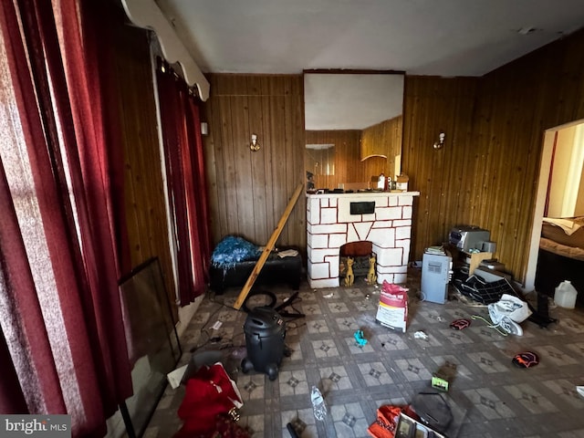 miscellaneous room featuring wood walls