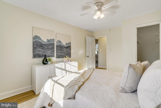 bedroom featuring ceiling fan and light hardwood / wood-style flooring