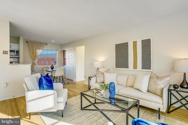 living room with light hardwood / wood-style floors