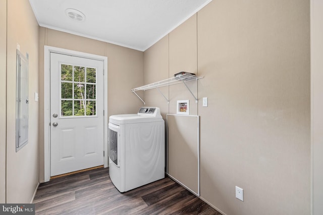 clothes washing area with dark wood-type flooring and washer / dryer