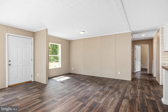 unfurnished living room with dark hardwood / wood-style floors