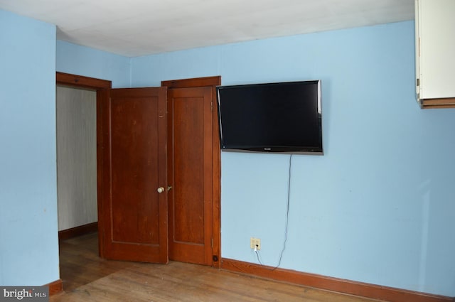 unfurnished bedroom with light hardwood / wood-style flooring