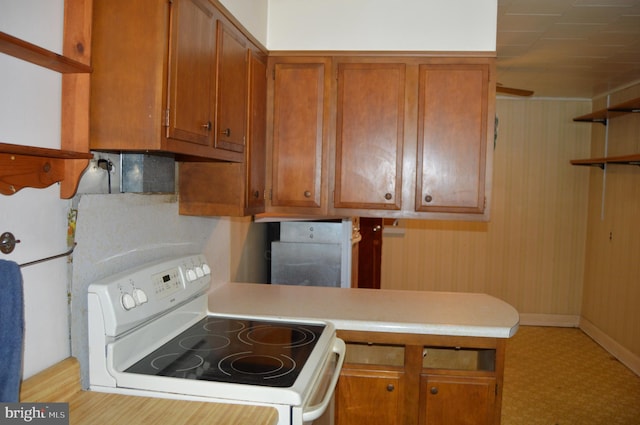 kitchen featuring white range with electric stovetop