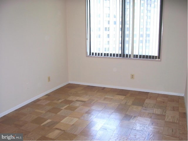 empty room with light parquet floors