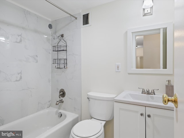 full bathroom with tiled shower / bath, vanity, and toilet