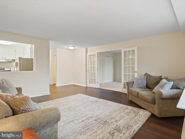 living room featuring dark hardwood / wood-style flooring and french doors