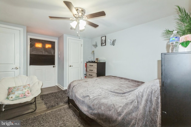 bedroom with ceiling fan and wood finished floors