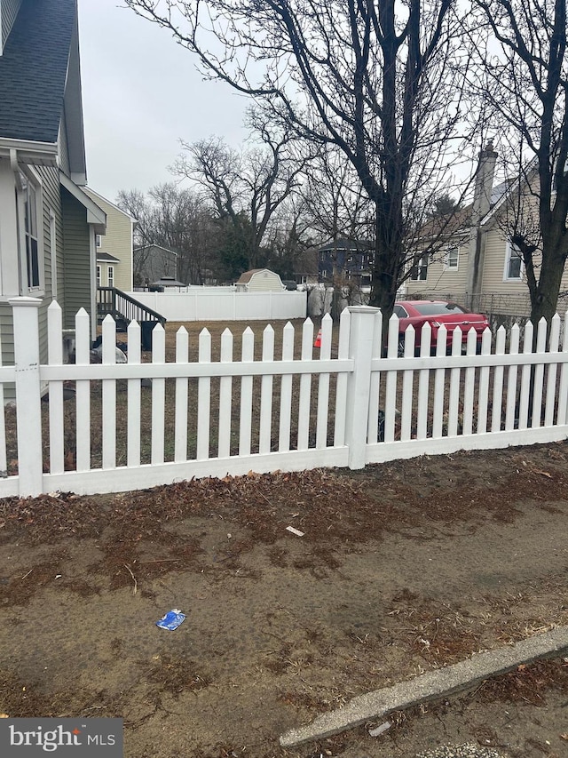 view of gate featuring a fenced front yard