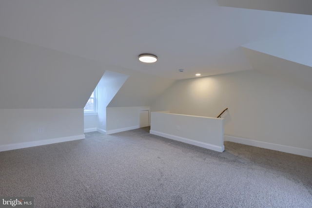 bonus room featuring lofted ceiling and carpet floors