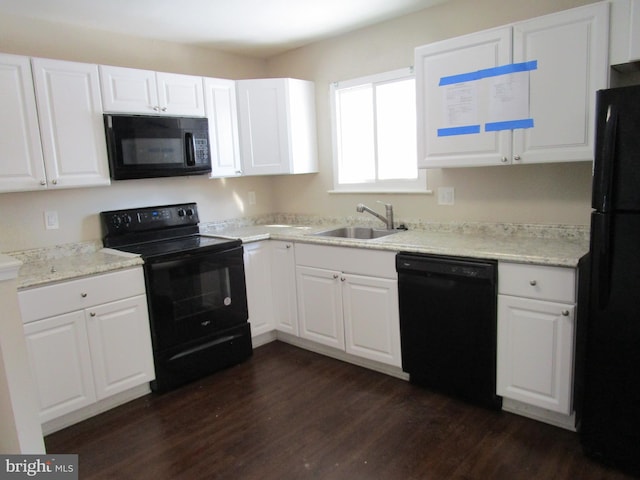 kitchen featuring white cabinetry, dark hardwood / wood-style floors, sink, and black appliances