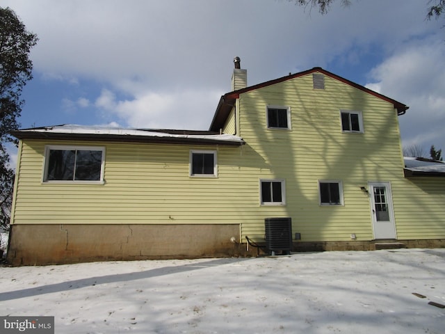 rear view of property featuring central AC