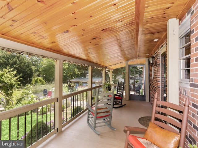 sunroom with wooden ceiling