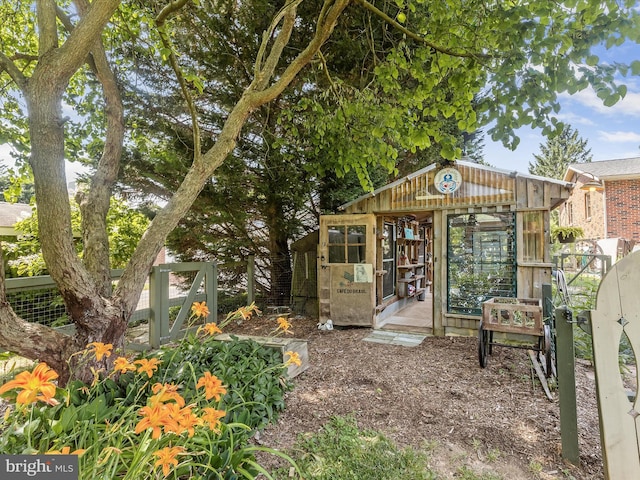 back of property with an outbuilding