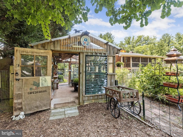 view of community with an outbuilding