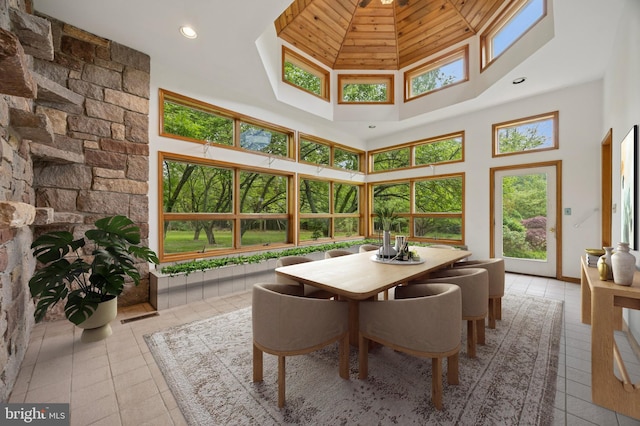 tiled dining space featuring a high ceiling