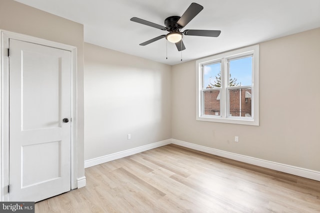 unfurnished room featuring light hardwood / wood-style floors and ceiling fan