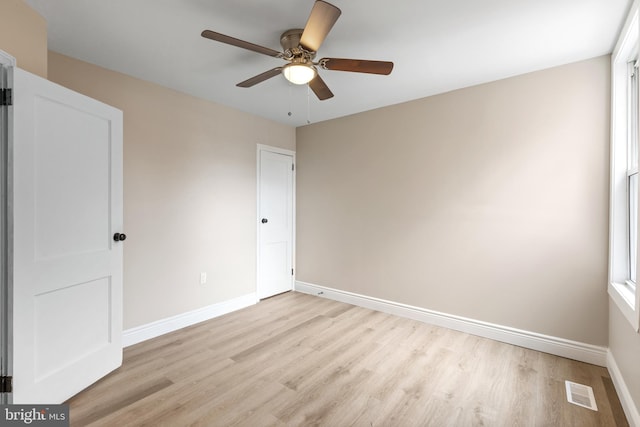 spare room featuring ceiling fan and light wood-type flooring