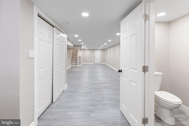 corridor featuring light hardwood / wood-style flooring