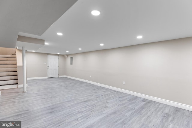 basement featuring light hardwood / wood-style floors