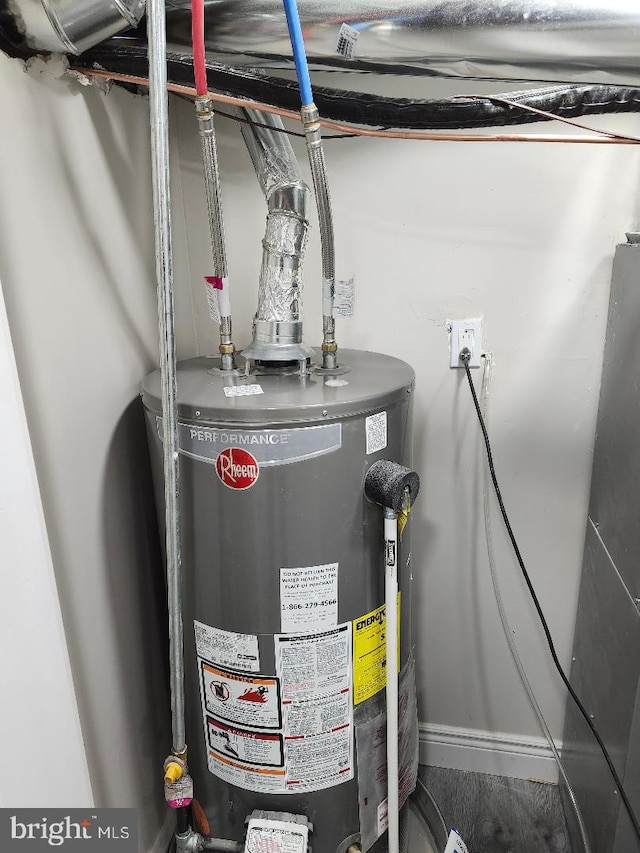 utility room featuring gas water heater