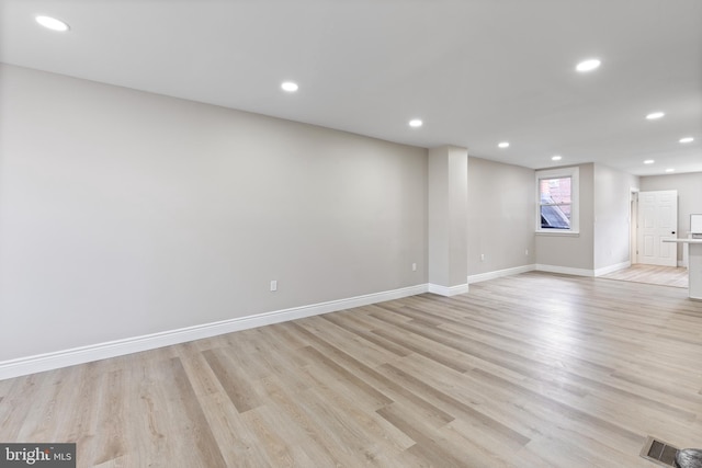 spare room with light wood-type flooring