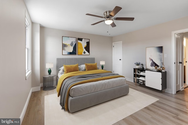 bedroom featuring hardwood / wood-style floors and ceiling fan