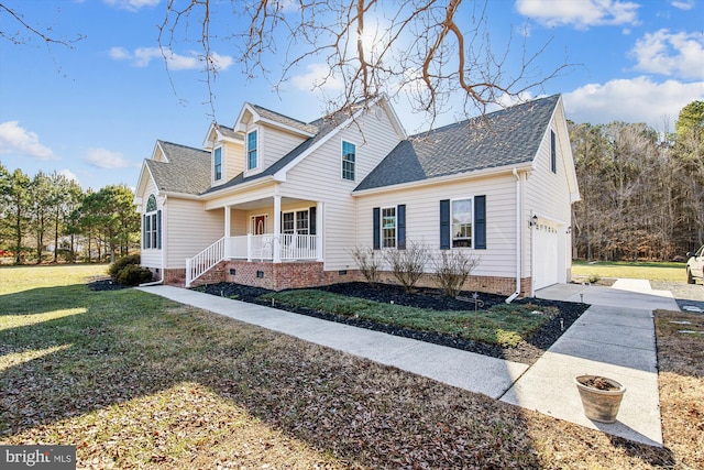 cape cod home with a garage, a front yard, and covered porch